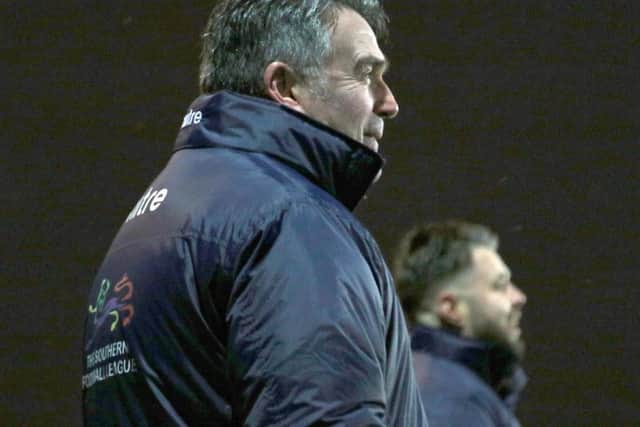 Poppies head coach John Ramshaw watches on