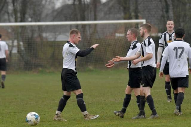 Moulton celebrate one of their goals in the 8-2 win over Corby Pegasus