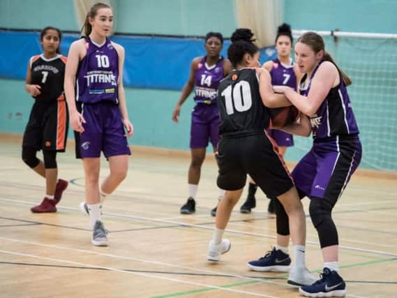 Emma Wickham battles for possession during Titans win over Leicester Warriors in the U16 Girls North Conference