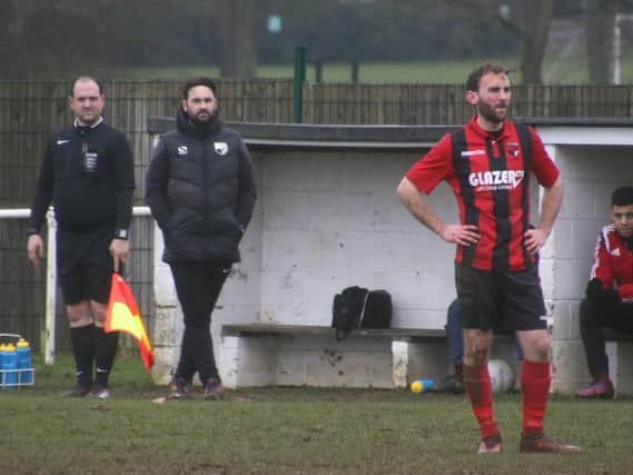 Whitworth boss James Mallows watches on during his team's 4-2 home defeat to Sleaford Town in the Premier Division at the weekend. Pictures by Peter Short