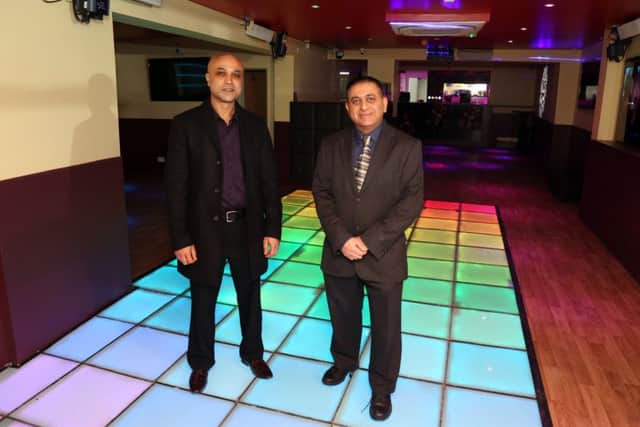 Manager Shomor Miah (left) with owner Sanjai Tailor (right) inside Pop Central in Kettering
