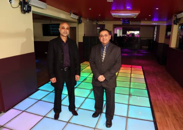 Manager Shomor Miah (left) with owner Sanjai Tailor (right) inside Pop Central in Kettering