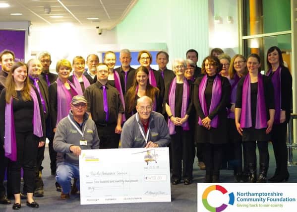 Members of The Melody Choir hand over the fundraising cheque. NNL-180219-135831005