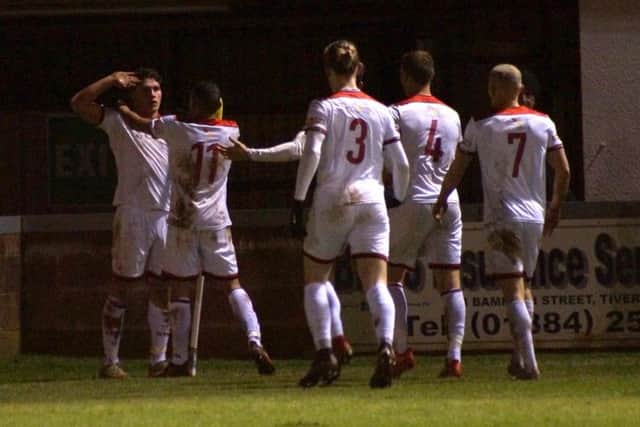 Mathew Stevens celebrates after he put Kettering Town 2-0 up at Tiverton Town. Pictures by Peter Short
