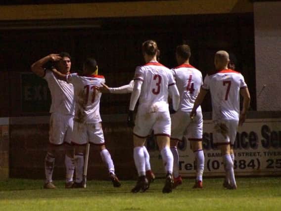 Mathew Stevens celebrates after he put Kettering Town 2-0 up at Tiverton Town. Pictures by Peter Short