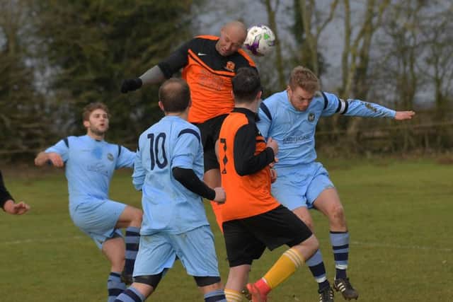 Action from the 1-1 draw between Spratton and Kettering Nomads in the Premier Division. Picture by Dave Ikin