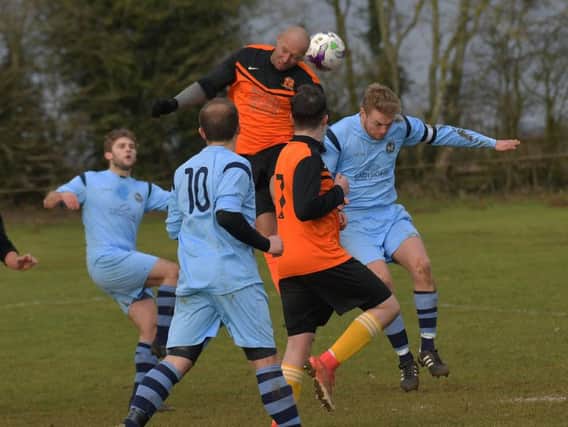 Action from the 1-1 draw between Spratton and Kettering Nomads in the Premier Division. Picture by Dave Ikin