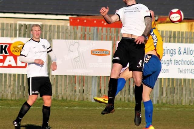 Paul Malone challenges for a high ball during Corby Town's 3-2 win at Stocksbridge Park Steels last weekend. Picture by David Tilley