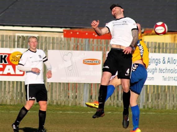 Paul Malone challenges for a high ball during Corby Town's 3-2 win at Stocksbridge Park Steels last weekend. Picture by David Tilley