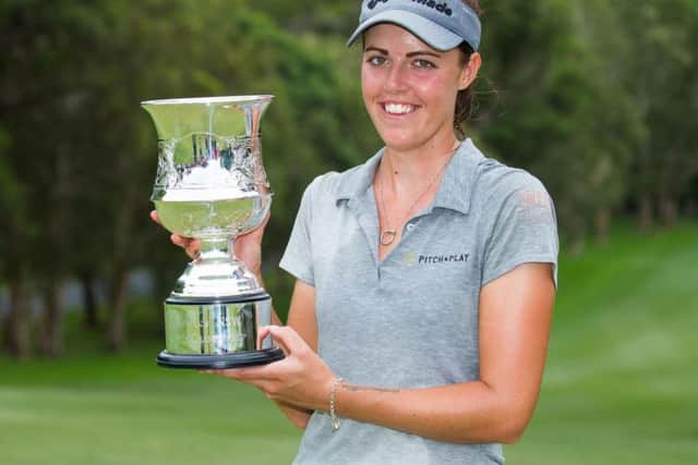 Meghan MacLaren proudly shows off her trophy after winning the New South Wales Open