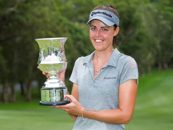 Meghan MacLaren proudly shows off her trophy after winning the New South Wales Open