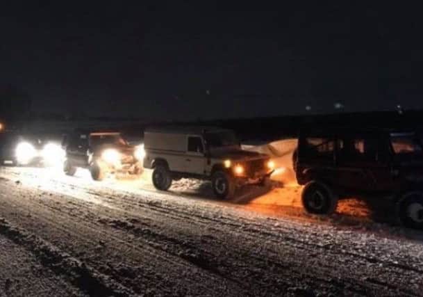 Local drivers were out until the early hours helping those stranded in the snow. NNL-180503-133647005