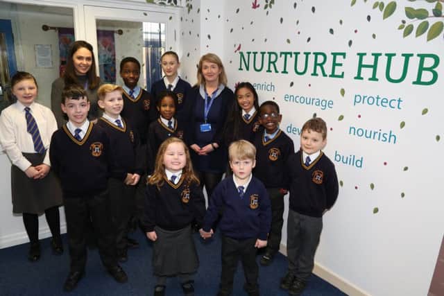 Deputy headteacher Rachael Simpson (back left), headteacher Maire Hayes (back right) and pupils from the school. NNL-180603-144005005