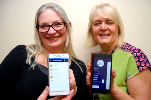 Naomi Fleming and Julie Fosbrook with the app. NNL-180703-110502005