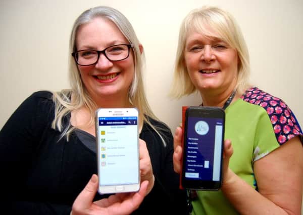 Naomi Fleming and Julie Fosbrook with the app. NNL-180703-110502005