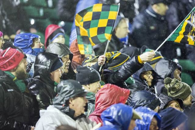 SINGING IN THE RAIN - Saints fans at The Rec on Friday (Picture: Kirsty Edmonds)