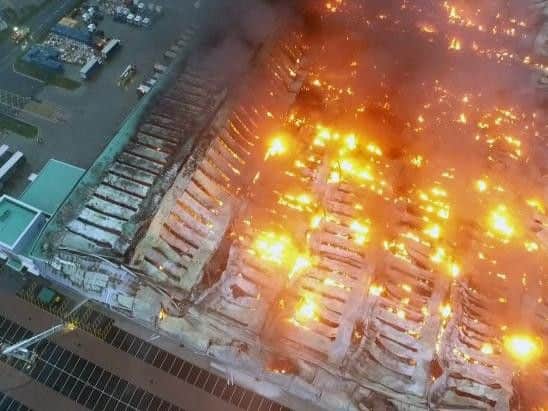 The warehouse in Drayton Fields will be demolished following a large-scale fire.