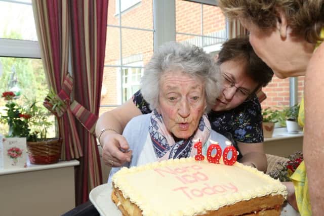 Nora Cheatle blows out the candles. NNL-180316-151926005