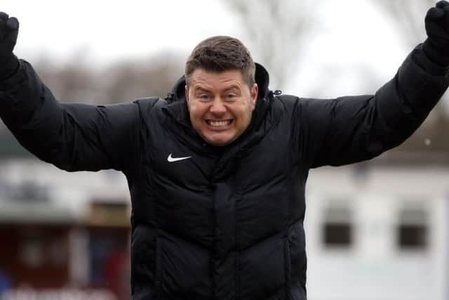 Wellingborough boss Nathan Marsh shows his delight after one of his team's goals