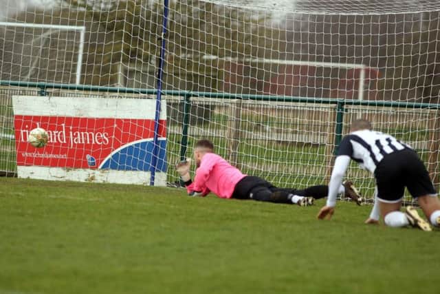 Albert Akinremi's shot beats the Daventry goalkeeper to give the Doughboys the lead