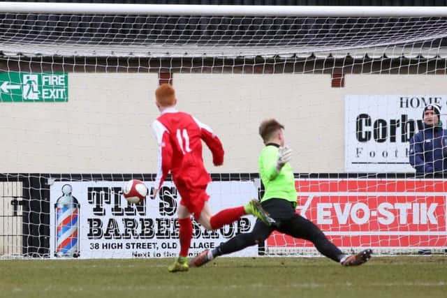 Oliver Bassett fires home Gresley's second goal at Steel Park