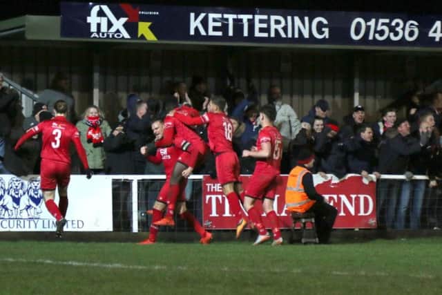 Brett Solkhon takes the congratulations after scoring Kettering Town's equaliser in their 4-1 victory over Royston Town. Pictures by Peter Short