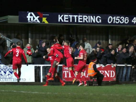 Brett Solkhon takes the congratulations after scoring Kettering Town's equaliser in their 4-1 victory over Royston Town. Pictures by Peter Short