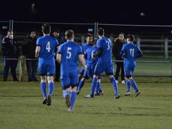 Dan White takes the congratulations after he scored in Desborough Town's 3-1 derby success at Harborough Town in midweek. Picture by Andrew Carpenter