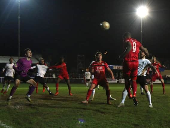 Aaron O'Connor heads home his 28th goal in all competitions this season during Kettering Town's 4-1 win over Royston Town. Picture by Peter Short