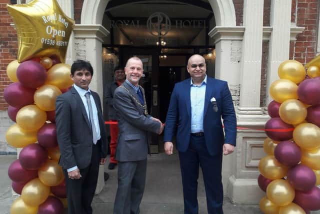 L-R: Rakesh Patel, Cllr James Burton and Raj Punni at the ribbon cutting. NNL-180322-132111005