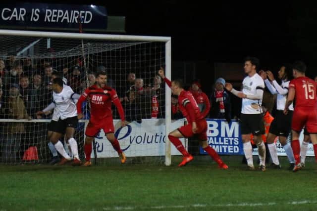 Brett Solkhon heads off to celebrate after he scored Kettering Town's equaliser in Tuesday's 0-1 victory over Royston Town. Picture by Peter Short