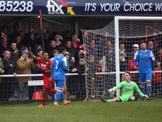 Aaron O'Connor heads off to celebrate after he scored Kettering Town's third goal in the 3-0 victory over Frome Town at Latimer Park. Pictures by Peter Short