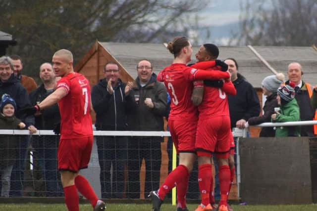 Kettering celebrate their opening goal at Latimer Park
