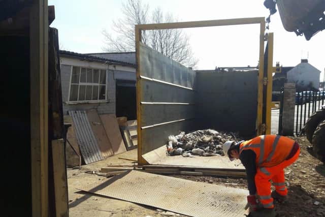 Some of the rubbish being cleared at the United Footwear site in Stamford Road. NNL-180326-140449005