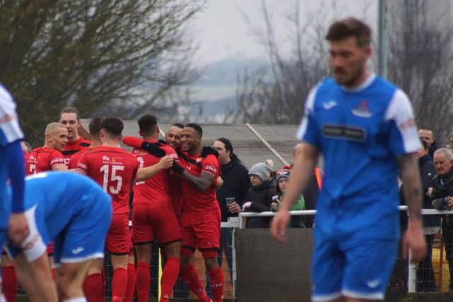 Kettering Town's players celebrate their opening goal in Saturday's 3-0 home success over Frome Town. Picture by Peter Short