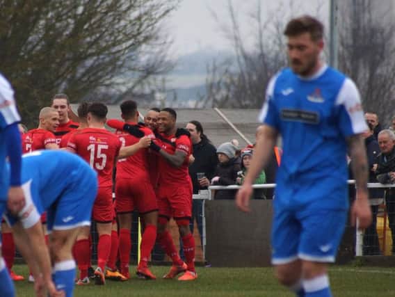 Kettering Town's players celebrate their opening goal in Saturday's 3-0 home success over Frome Town. Picture by Peter Short