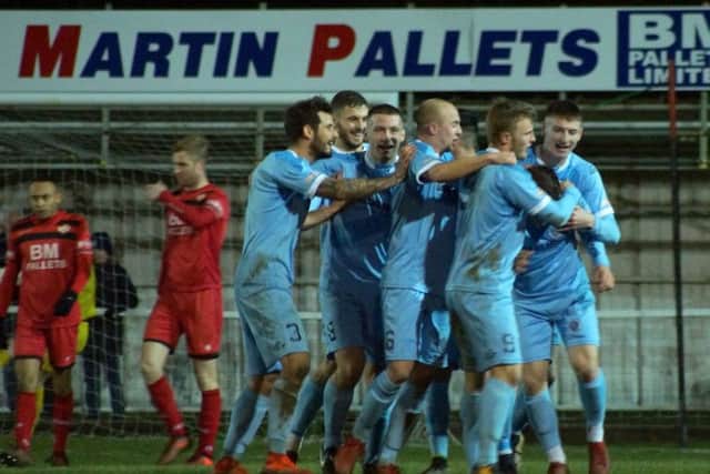 Dorchester celebrate one of their three goals at Latimer Park
