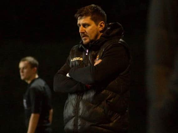 Marcus Law watches on during Kettering Town's 4-3 win over Dorchester Town at Latimer Park last night. Pictures by Peter Short