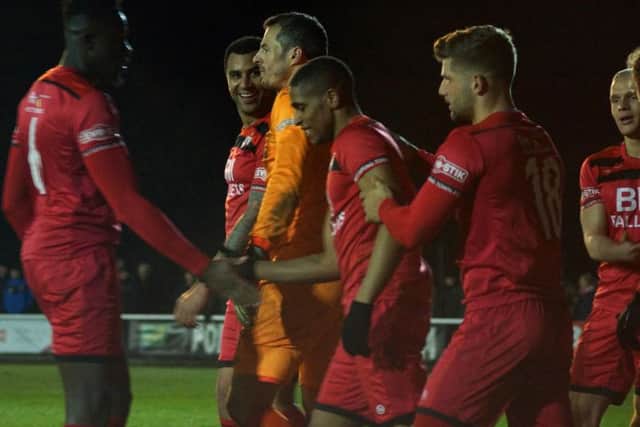 The Poppies players celebrate their winning goal