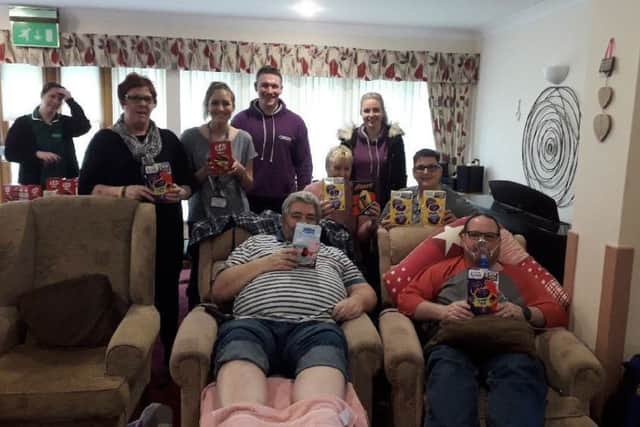 Tom and Lauren with staff and patients at Lakelands Hospice