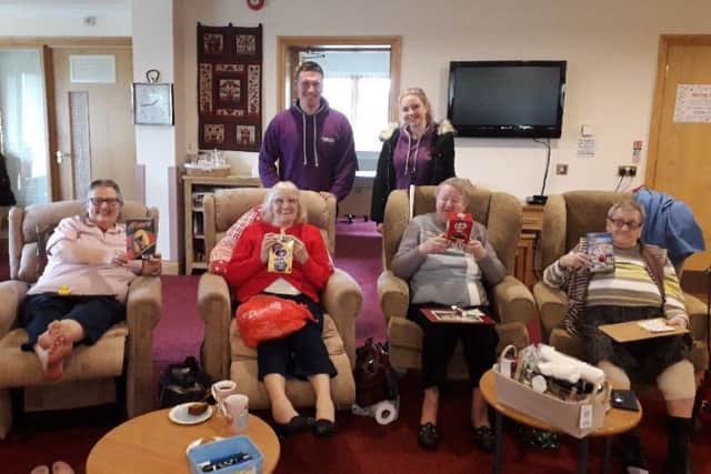 Tom and Lauren with some of the patients at Lakelands Hospice