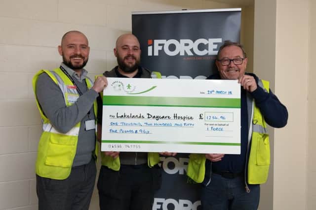 Jim and James with the cheque for Lakelands Hospice