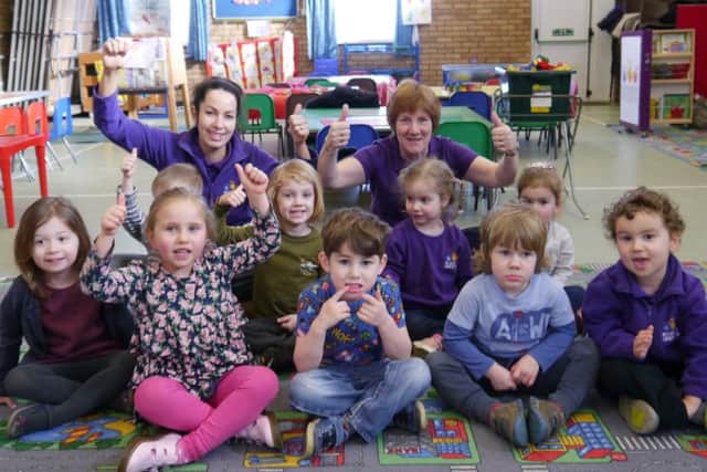 Staff and youngsters celebrating the outstanding rating