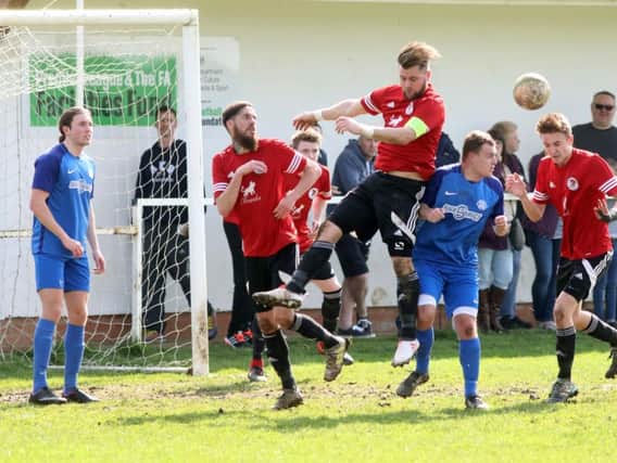 Action from the 0-0 draw between Irchester United and Lutterworth Athletic in Division One. Pictures by Alison Bagley