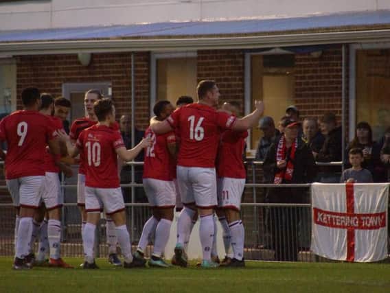 The Kettering Town players celebrate one of their goals during the 7-0 win at Gosport Borough. Picture by Peter Short