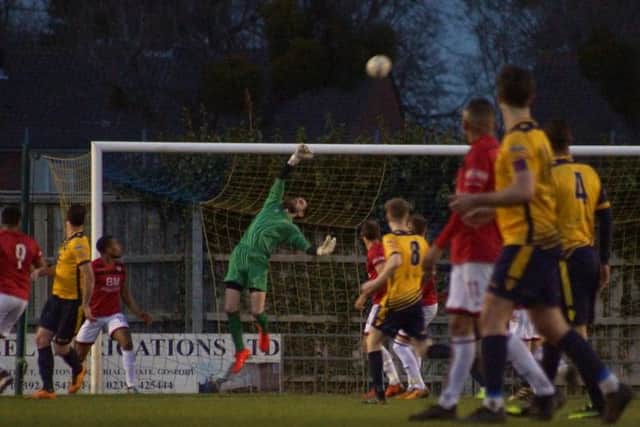 Paul White makes a save on his way to keeping a 19th clean sheet of the season
