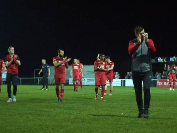 Marcus Law leads the applause for the Kettering Town fans following last night's 2-0 victory over Weymouth. Pictures by Peter Short