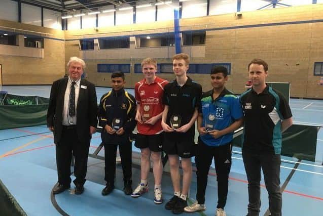 Sam Wilson, in red, with his award NNL-180423-143518005