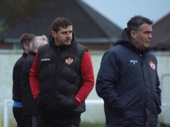 Marcus Law watches on during Kettering Town's 3-2 home defeat to Tiverton Town. Pictures by Peter Short