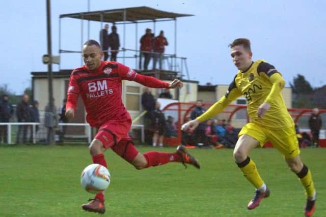 Rhys Hoenes in action for Poppies